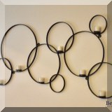 D05. Interlocked rings wall candle holder. 